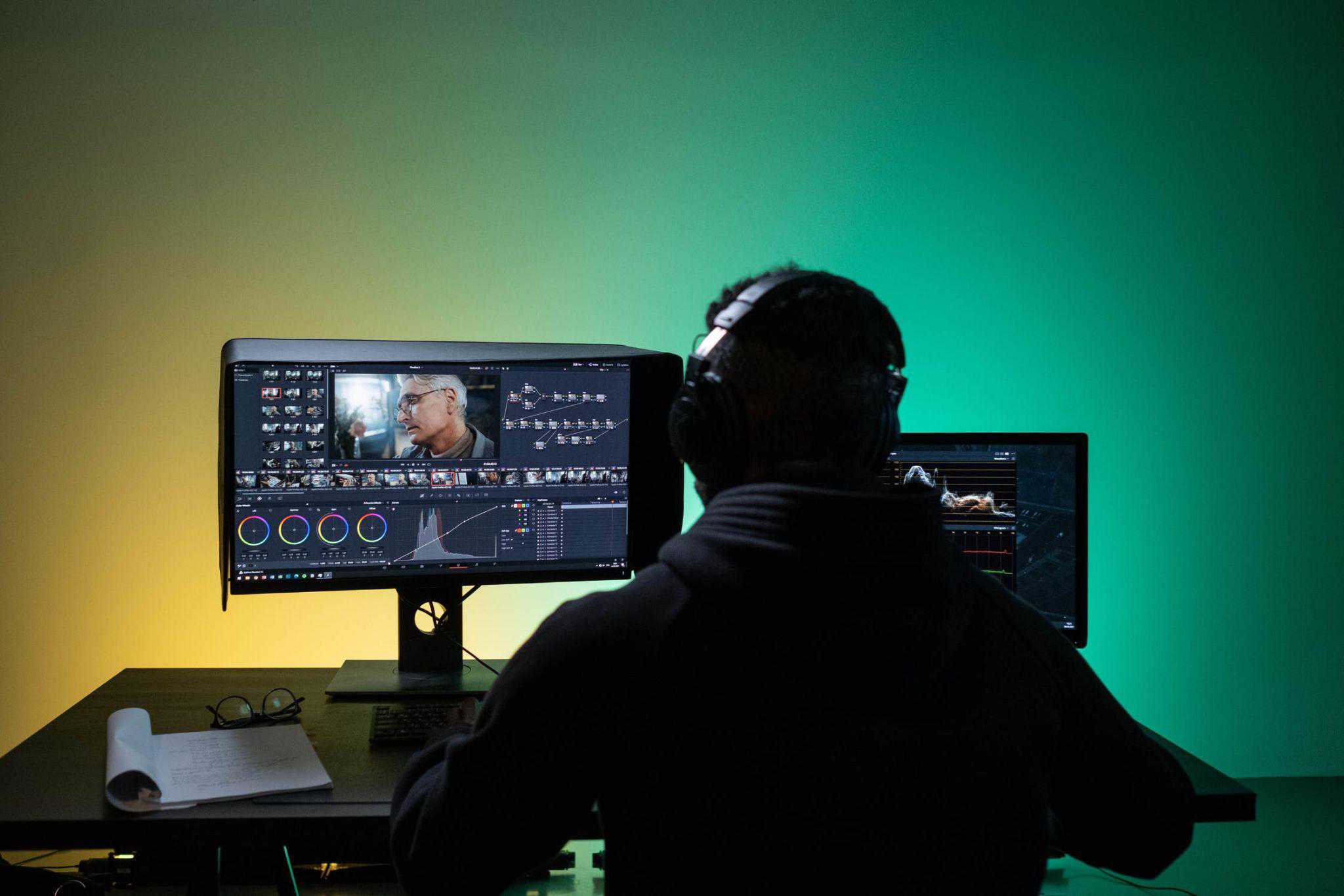 Man sitting at a computer doing video editing