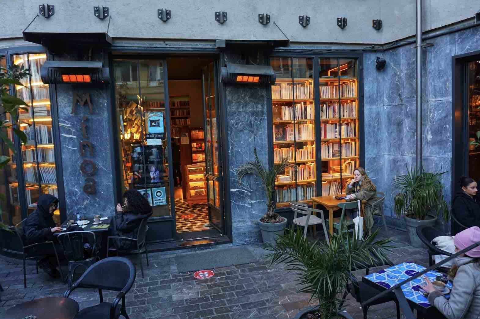 A bookstore cafe with people sitting at tables outside
