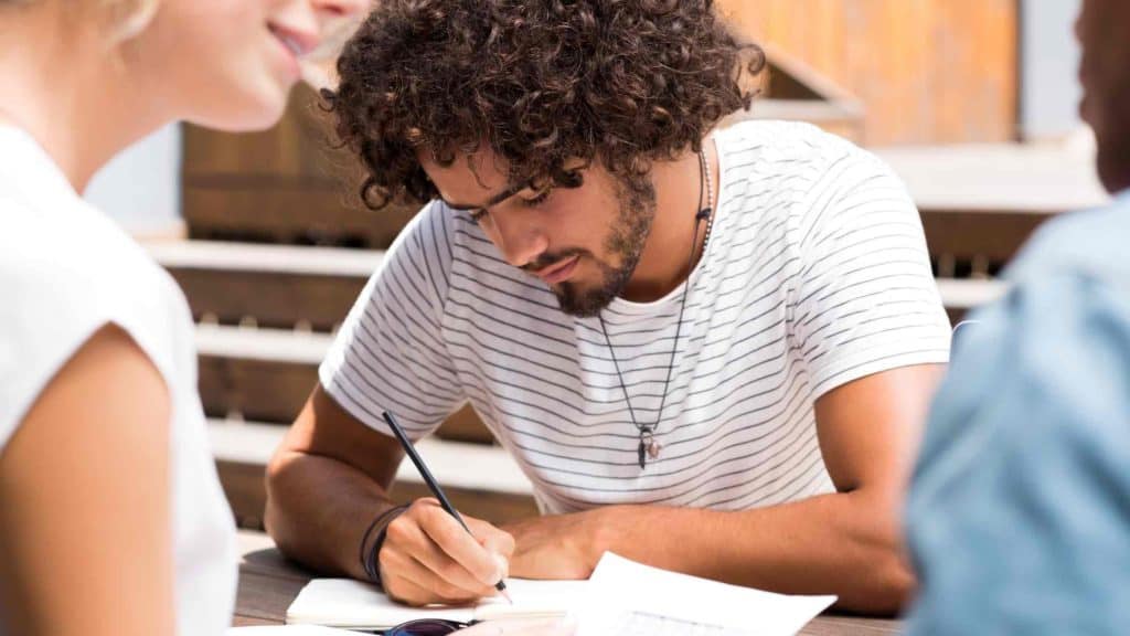 Man writing in a notebook