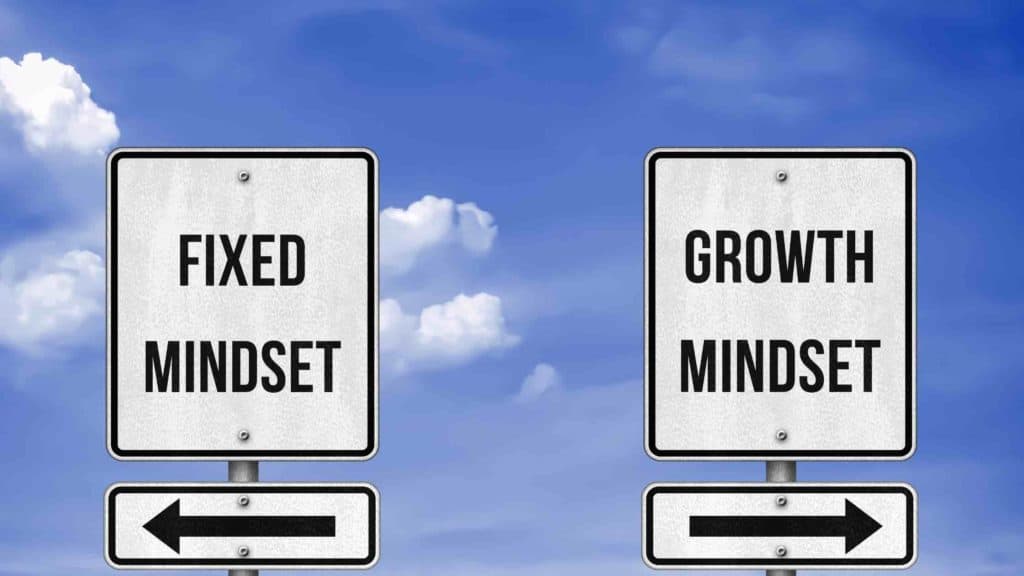 Road signs - fixed mindset left, growth mindset right